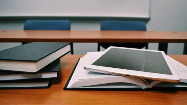 books and iPad on desk