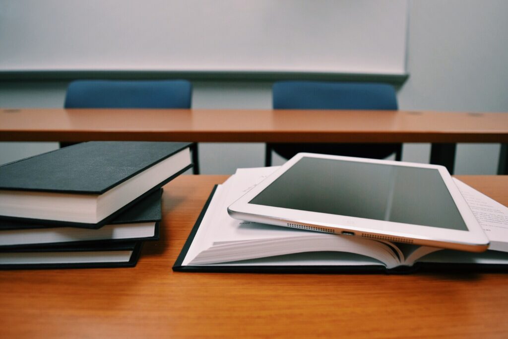 books and iPad on desk